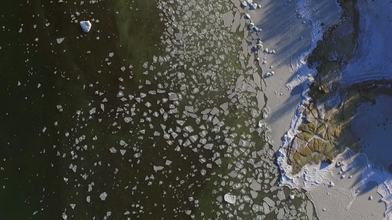 Abstract aerial view of snowy coast.