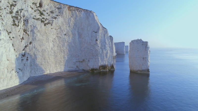 Flying Through Eroded Chalk Cliffs at Sunrise