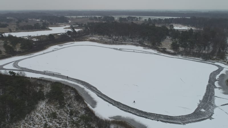 Aerial view of a forest in winter with snow, looking down, Twente