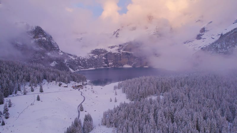 Oeschinen Lake in the Snowy Mountains of Switzerland on a Foggy Morning