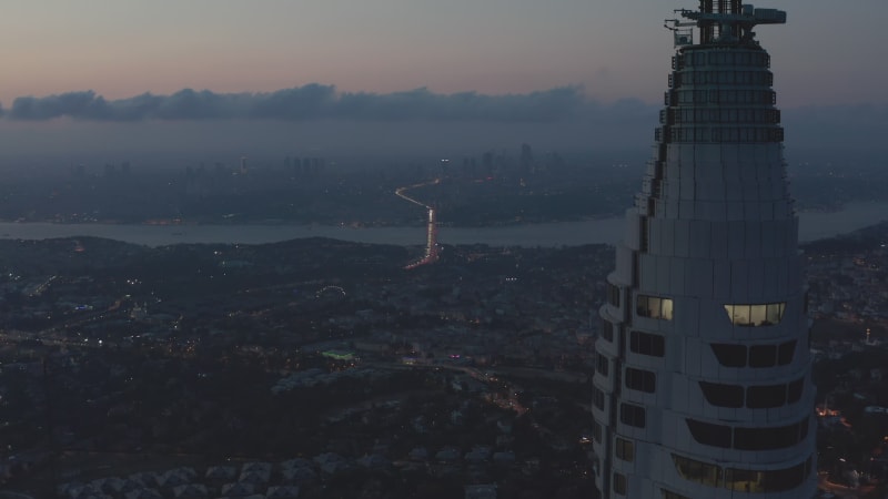 Huge Skyscraper Istanbul TV Tower on Hill with epic view over all of Istanbul, Turkey at Dusk, Aerial Drone Shot