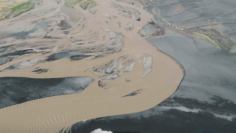 Aerial view of glacial river Jokulsa between black outwash plains, Iceland.