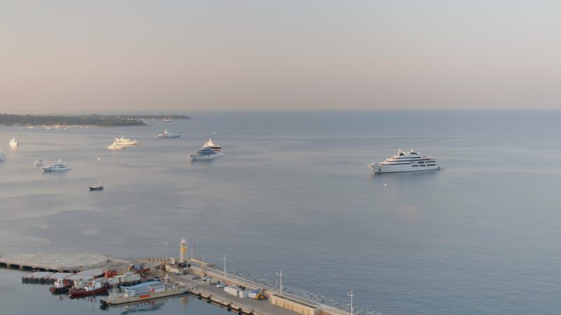 Mega Yachts Moored Outside of Cannes Port at Sunrise