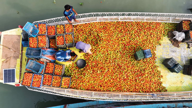 Aerial View of people on boats along the river in Dhaka, Bangladesh.