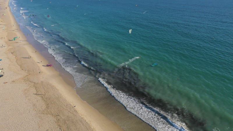 Aerial view of people doing water sport in Tarifa, Spain.