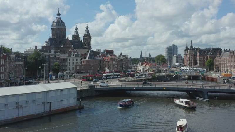 Towards Basilica of Saint Nicholas, Amsterdam over River with Boat, Aerial Drone