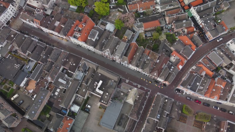 Aerial high pan footage over rooftops in sHertogenbosch, Netherlands