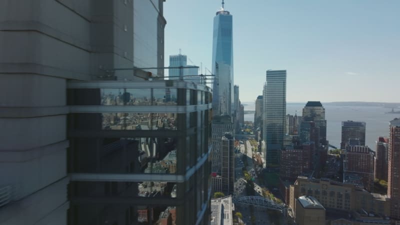 Fly around Travelers Building and reveal cityscape with tall modern skyscrapers in Financial district. Manhattan, New York City, USA