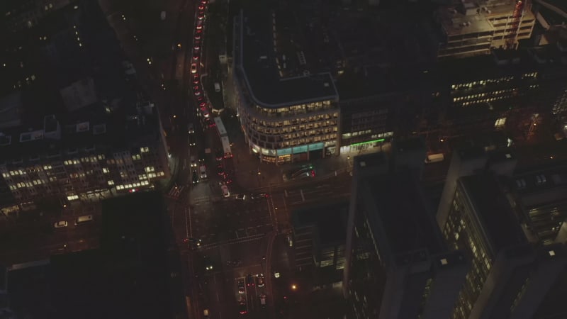 AERIAL: Slow Overhead Shot of City at Night with Lights and Traffic, Cologne, Germany