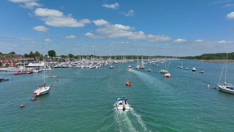 Yachts, Speedboats and Vessels on a River in the Summer