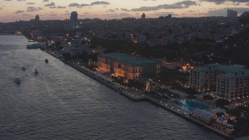 Beautiful Ciragan Palace Kempinski on Riverside of Bosphorus in Istanbul at Dusk, Aerial View