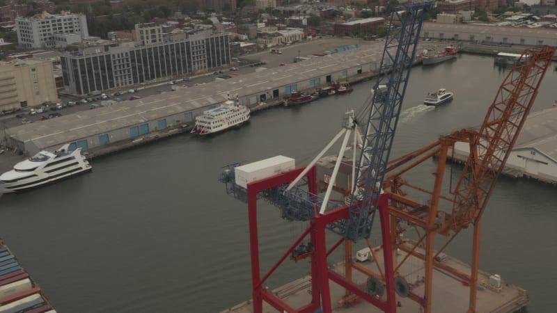 High angled view of industrial cranes in docks in New York City on cloudy day