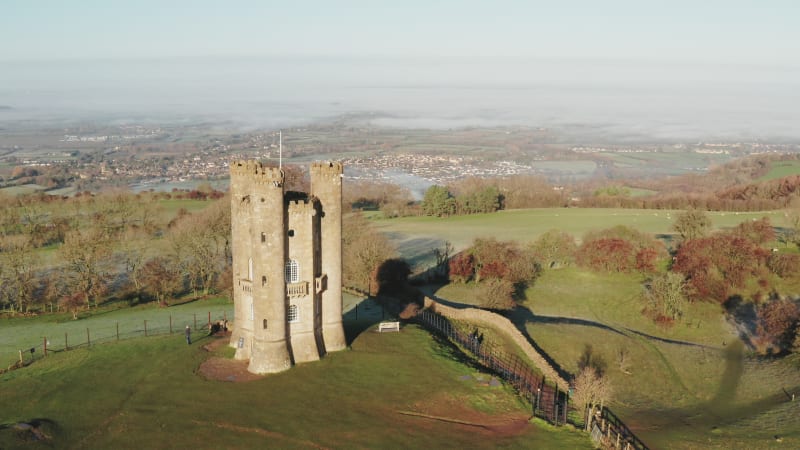 Broadway Tower, a famous old building landmark in The Cotswolds Hills, iconic English tourist attraction in beautiful British countryside with green fields, Gloucestershire, England, UK