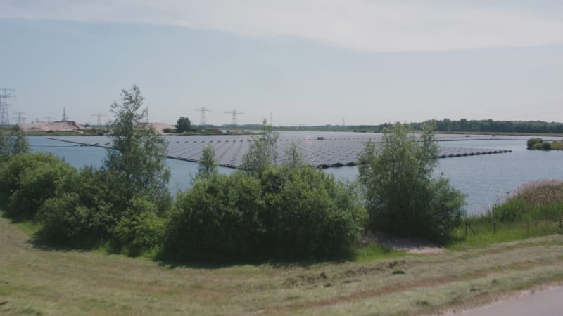 Reveal Shot Of Solar Panels On Lake Bomhofsplas In The Netherlands