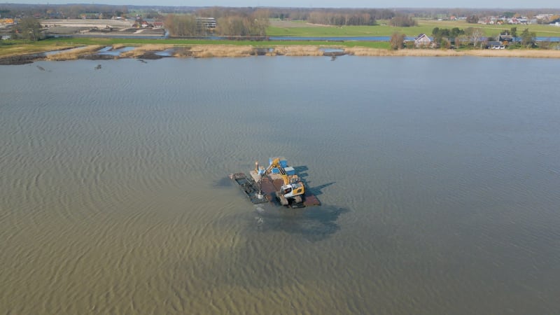 Excavator working in a lake