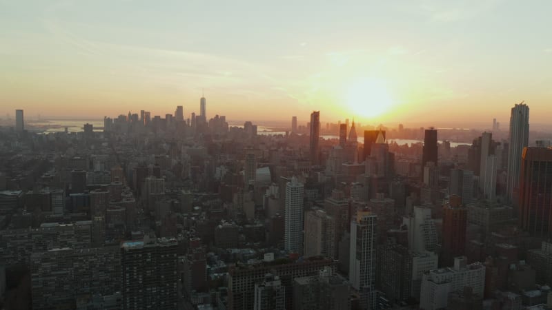 Picturesque sunset above city development with tall downtown skyscrapers. Manhattan, New York City, USA