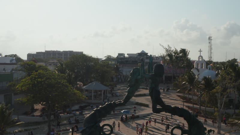 Revealing the surroundings of the Portal Maya sculpture in Playa del Carmen. Dolly out