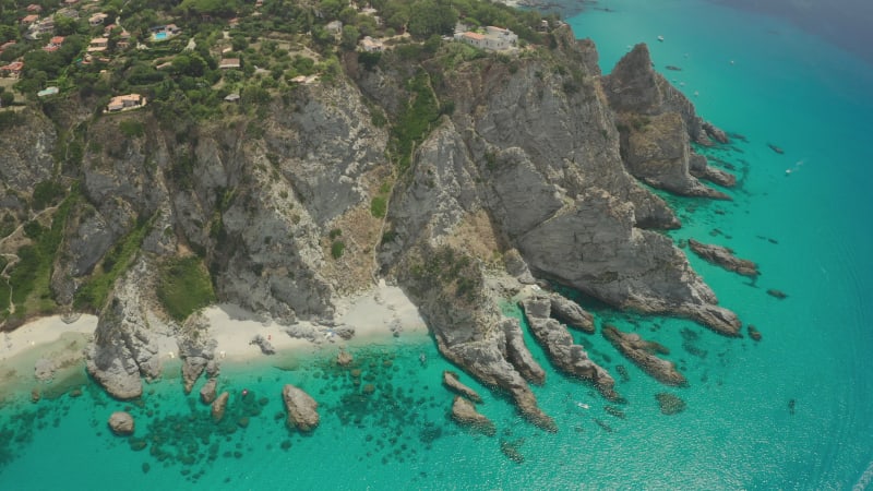 Spectacular aerial view of white rocky cliffs above a blue sea