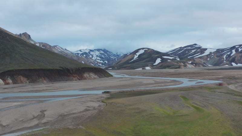 Drone view of Thorsmork mountains and river, highlands of Iceland. Stunning birds eye view of icelandic countryside with Krosssa river and green mossy canyon and valley