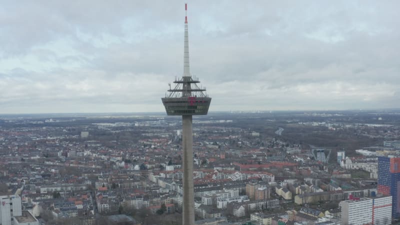 Forwards fly to ring on Colonius telecommunications tower. Former restaurant and lookout platform high above city. Cologne, Germany