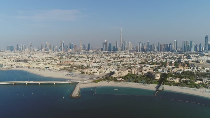 Aerial view Dubai city with road going towards the island Daria.