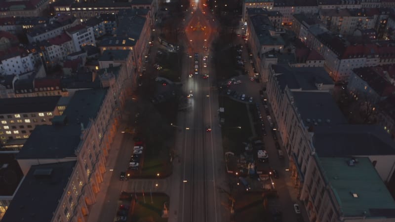 Scenic Aerial View of Majestic Street leading towards beautiful Palace building on top of the city, Maximilianeum overlooking Munich, Germany from Drone perspective Dolly in tilt up