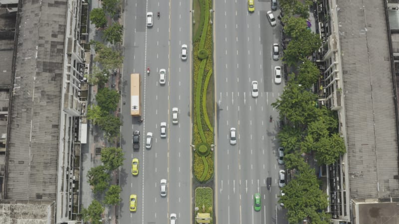 Aerial view of vehicles driving a busy road in Bangkok, Thailand.