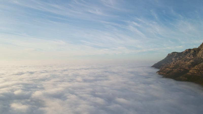 Aerial view of False bay covered in low cloud sunrise, Simonstown, Cape Town, South Africa.