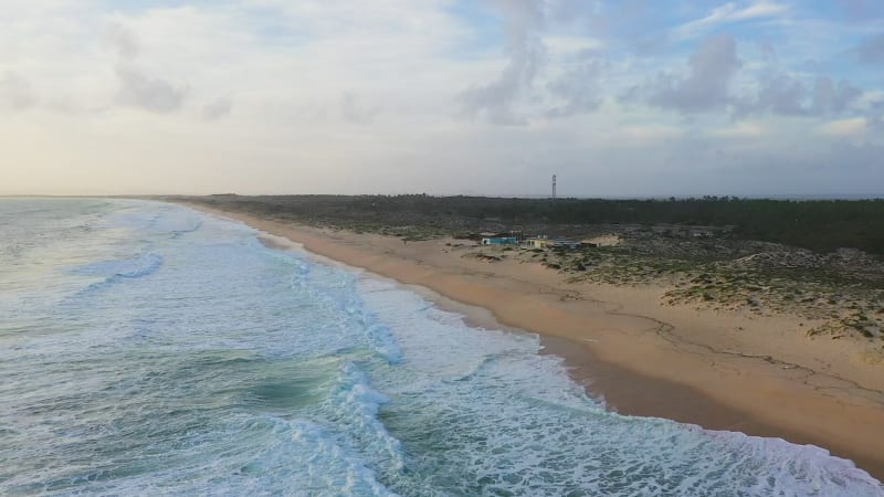 Aerial view of sandy beaches and waves.