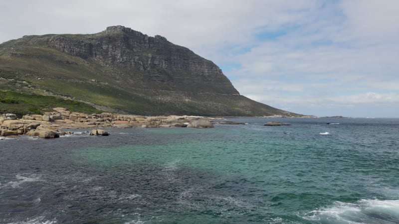 Aerial view of clear Atlantic ocean Llandudno coastline, Cape Town, South Africa.