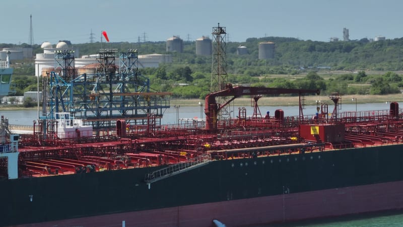 Petroleum Tanker Vessel Offloading Fuel and Oil at a Refinery Port