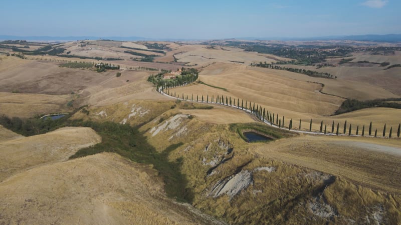 Aerial view of Val d'Orcia countryside landscape in Tuscany, Italy.