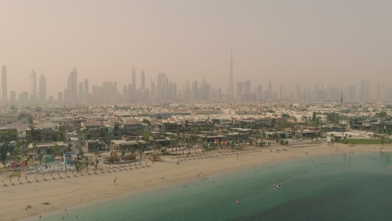 Aerial view of Jumeirah public beach during a dusty day.