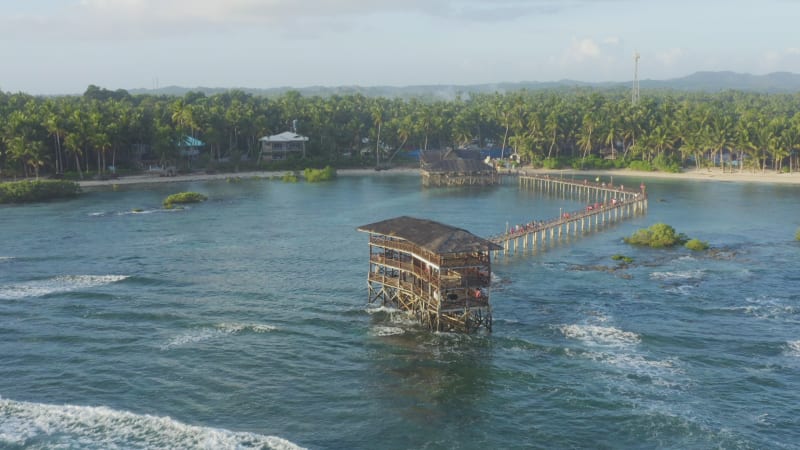 Wooden jetty and hut on the coast of a Philippine island