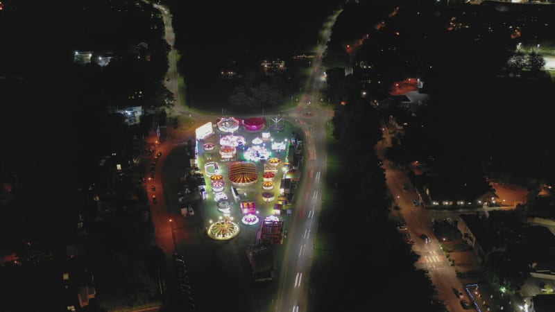 Aerial Hyperlapse of a Travelling Fairground in a Town