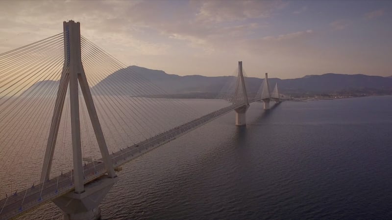 Aerial view of the Rion-Antirion Bridge at sunset.