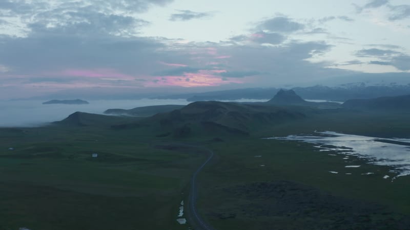 Birds eye of stunning panorama of iceland coastline in misty and foggy day. Drone view of icelandic landscape and Ring Road, the most important highway of Iceland