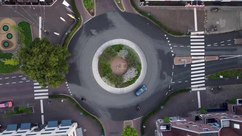 Slow rotating ascending view of traffic roundabout in Zeist, the Netherlands.