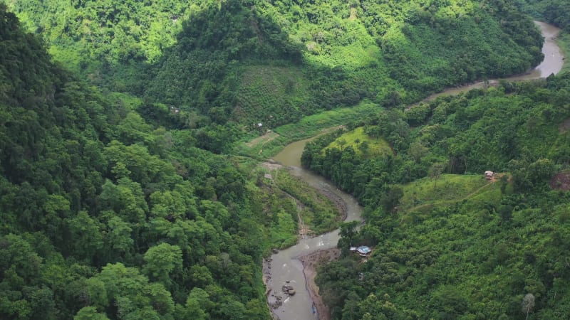 Aerial view of a river crossing the valley in Bandarban, Bangladesh.