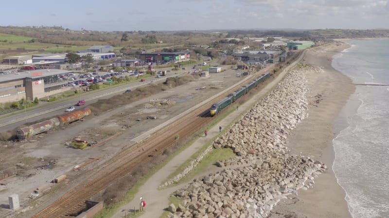 Commuter Train Alongside the Sea Aerial View