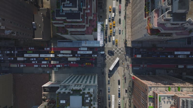 Aerial birds eye overhead top down view of streets and intersection clogged by vehicles. Heavy traffic in city. Manhattan, New York City, USA