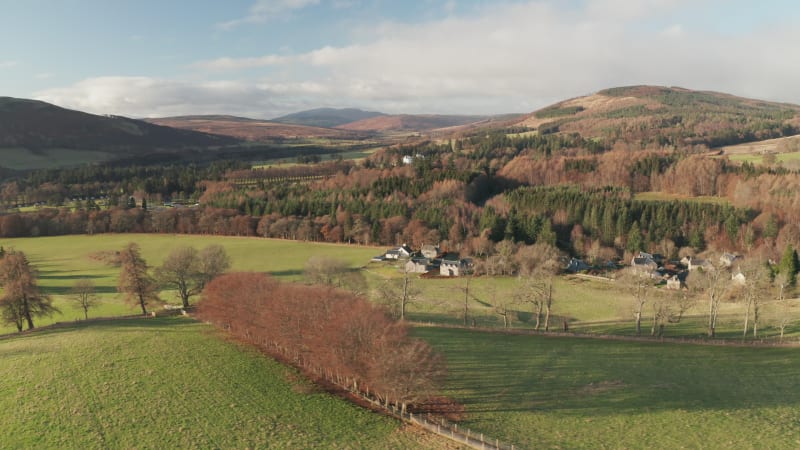 Aerial view of houses in rural Scottish countryside