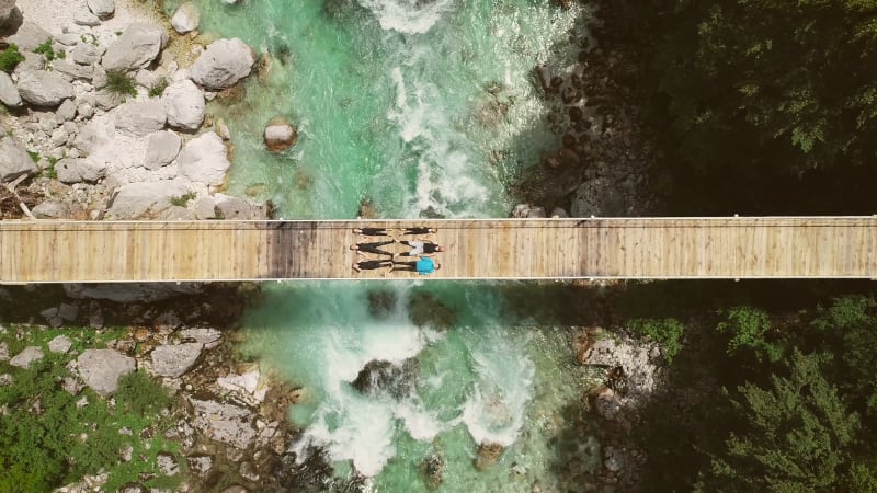 Aerial view of people lying on bridge over.