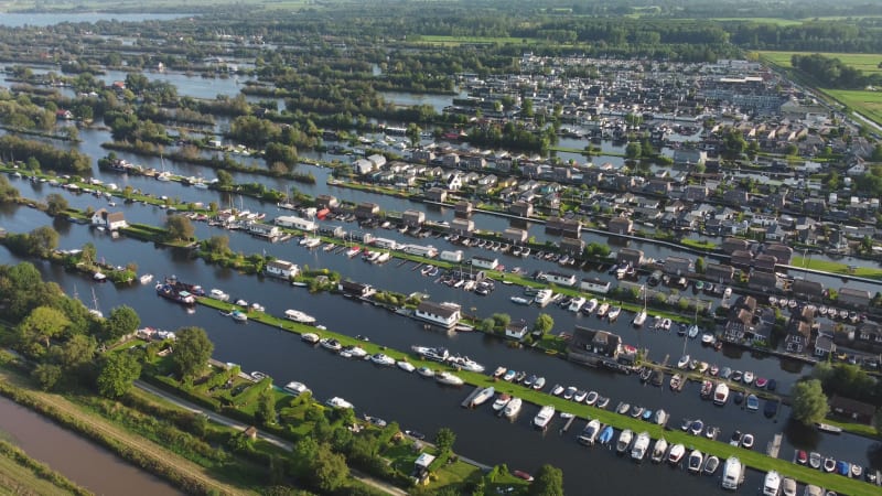 Houses on the Loosdrechtse Plassen (Loosdrecht Lakes) on a summer day in the Netherlands.