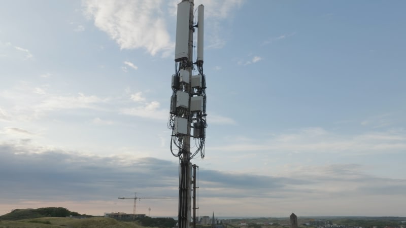 Overhead View of a 4G/5G Transmission Tower near Industrial Site and Sea in Wijk Aan Zee, Netherlands