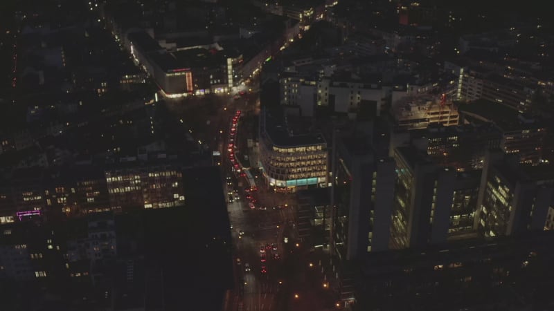 AERIAL: Slow Overhead Shot of City at Night with Lights and Traffic, Cologne, Germany