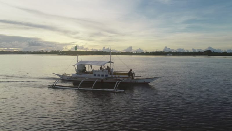 Aerial view of single filipino fishing boat near Lapu-Lapu city.