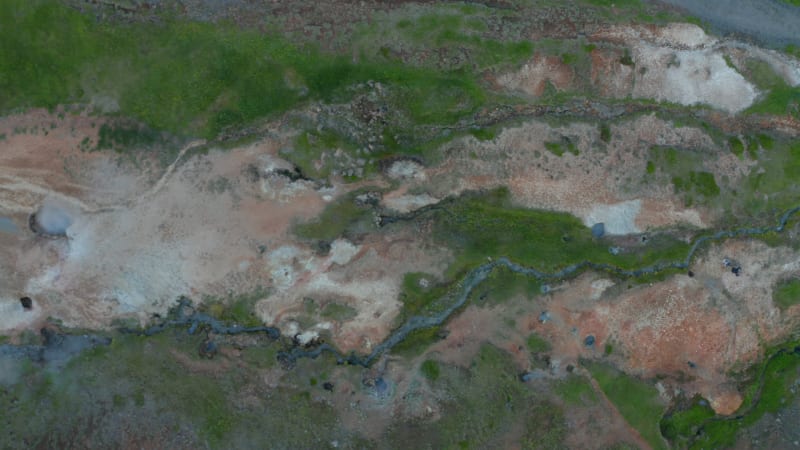 Overhead aerial view of geothermal area in Iceland with smoking fumaroles in Iceland. Top down view of amazing steaming craters landscape. Beauty in nature