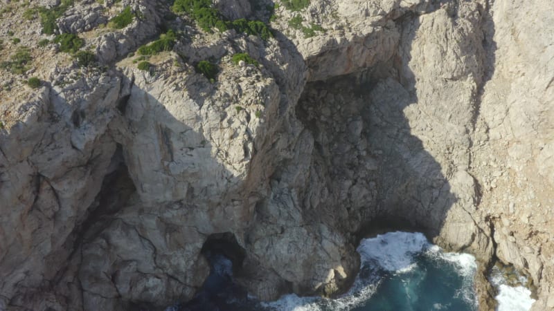 Beautiful Drone Shot of Cliff and Blue Water Waves crMavic 2 prohing on Tropical Island Mallorca, Spain Vacation, Travel, Sunny, Waves