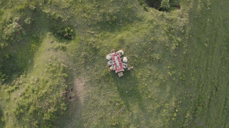 Aerial view of people eating outside.